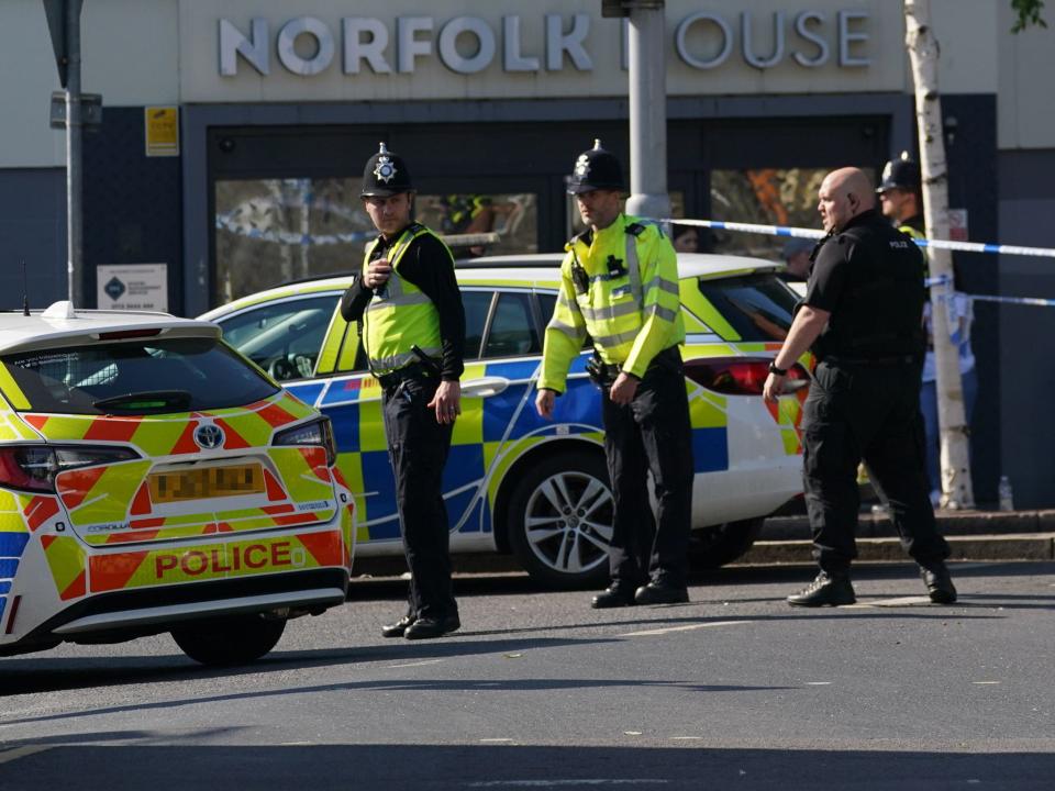 Police officers in Nottingham city centre (PA)