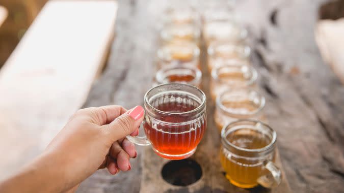 Young woman drinking green tea.