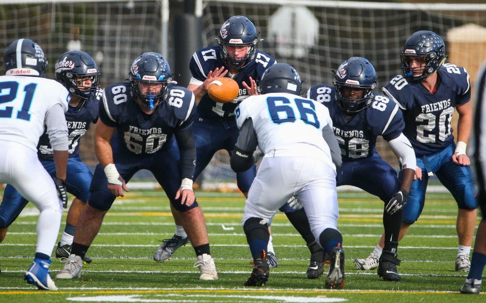 Wilmington Friends' Philip Crock (60), Myles Johnson (68) and Andrew McKenzie (20) block at the snap in the Quakers' 49-12 win in the DIAA Class 2A state tournament quarterfinals at Abessinio Stadium, Friday, Nov. 25, 2022.