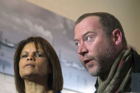 Ozana Rodrigues, the mother of Brian De Mulder, and Dimitri Bontinck, father of Jejoen Bontinck, who both have seen their son leaving for Syria after being indoctrinated by Islamist group Sharia4Belgium, react during an interview with Reuters in Antwerp January 29, 2015. REUTERS/Yves Herman