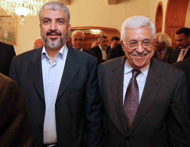 Hamas exiled chief Khaled Meshaal (L) and Palestinian president Mahmud Abbas meet in Cairo on November 24, 2011, in this photo released by the Palestinian Hamas movement. Abbas and Meshaal have agreed to expedite a stalled reconciliation deal between the rival factions, a Hamas official said Thursday