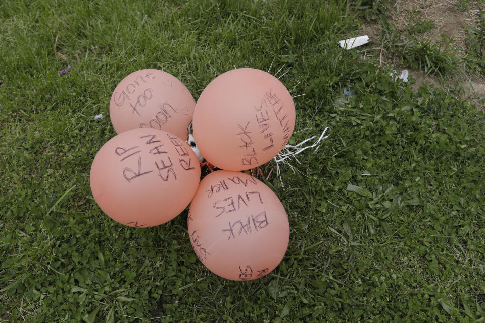 A display is seen, Friday, May 8, 2020, in Indianapolis. near the intersection of 62nd and Michigan Road in Indianapolis, Ind., where Dreasjon Reed was fatality shot by the Indianapolis Metropolitan Police Department. Indianapolis Police Chief Randal Taylor solemnly promised thoroughness and transparency as his department investigates the latest fatal shootings of black men in the city by officers. (AP Photo/Darron Cummings)