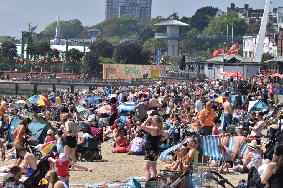 SOUTHEND, ENGLAND - MAY 31: Crowds gather to enjoy the warm sunny weather on Jubilee beach on May 31, 2021 in Southend, England. Today's bank holiday Monday brings highs of 77F (25C) and could be the hottest day of 2021 so far and the start of a 13-day heatwave. The continued spread of the Indian variant of coronavirus has cast doubt on the restrictions being lifted on June 21.  (Photo by John Keeble/Getty Images)