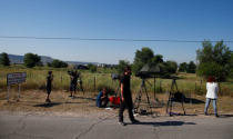 Journalists wait outside the prison where two of the five men cleared of gang rape of a teenager and convicted of a lesser crime of sexual abuse are due to leave jail after being granted provisional release in Alcala de Henares, near Madrid, Spain, June 22, 2018. REUTERS/Javier Barbancho