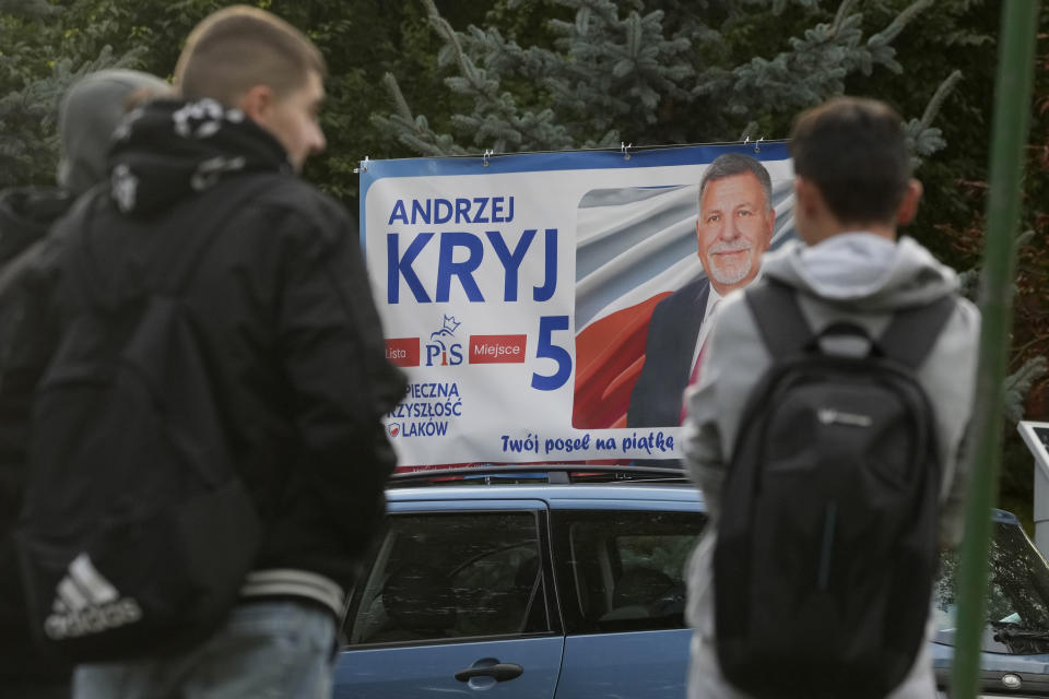 Campaign poster of a ruling conservative PiS (Law and Justice) party candidate running Sunday in Poland's crucial parliamentary elections is displayed on car roof in Sandomierz, Poland, Friday, Oct. 13, 2023. At stake in the vote are the health of the nation's democracy, strained under the Law and Justice rule, and the foreign alliances of a country on NATO's eastern flank that has been a crucial ally. The main challenger is centrist Civic Coalition. (AP Photo/Czarek Sokolowski)