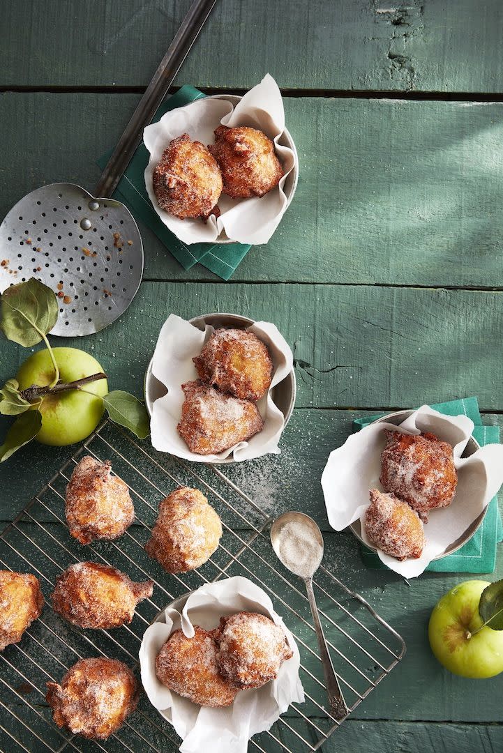 apple fritters dusted with cinnamon sugar on top