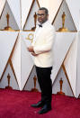 <p>Peele also went with white, wearing a light suit jacket with a deer antler pin as an ode to his film <em>Get Out</em>. (Photo: Getty Images) </p>