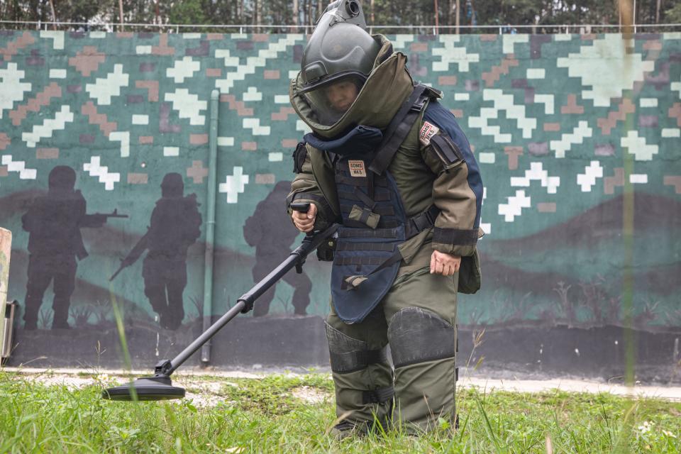 A serviceman uses a deminer to detect a "minefield" during an explosive disposal training of People's Armed Police in Nanning, South China's Guangxi Zhuang Autonomous region, May 16, 2023.