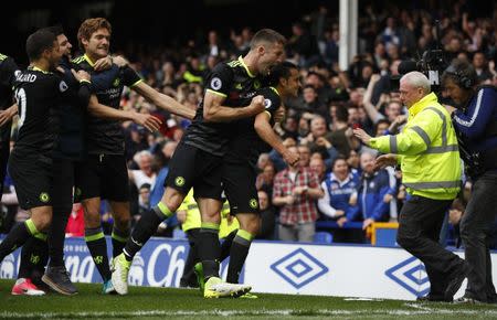 Britain Football Soccer - Everton v Chelsea - Premier League - Goodison Park - 30/4/17 Chelsea's Pedro celebrates scoring their first goal with teammates as a fan invades the pitch Reuters / Phil Noble Livepic