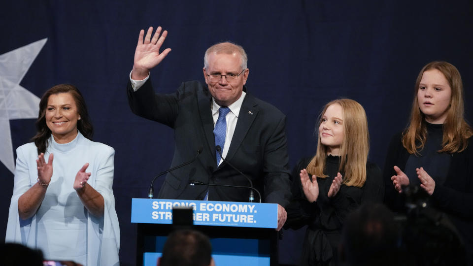 Australian Prime Minister Scott Morrison waves with his wife Jenny and daughter's Lily and Abbey at a Liberal Party function in Sydney, Australia, Saturday, May 21, 2022. Morrison has conceded defeat and has confirmed that he would hand over the leadership of the Liberal Party following his party's loss to Labor in today's federal election. (AP Photo/Mark Baker)