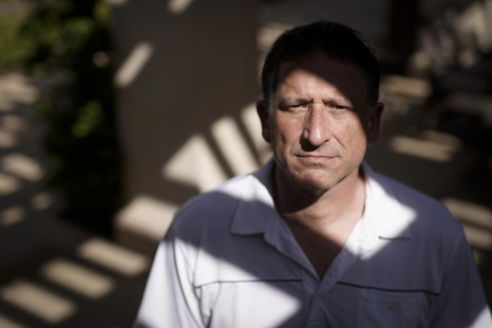 Keith Gartenlaub poses for a pictures near his home Wednesday, March 11, 2020, in Irvine, Calif. A former Boeing engineer, Gartenlaub, who was targeted with a FISA warrant because agents suspected him of having provided the designs of a C-17 transport plane to China. (AP Photo/Chris Carlson)