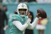 FILE - Miami Dolphins quarterback Tua Tagovailoa (1) looks to pass during the first half of an NFL football game against the Green Bay Packers, Sunday, Dec. 25, 2022, in Miami Gardens, Fla. Dolphins quarterback Tagovailoa sustained his second concussion of the season in last week’s loss to Green Bay, Miami coach Mike McDaniel confirmed Wednesday, Dec. 28. Tagovailoa has not been officially ruled out for Sunday's pivotal game at New England, though it's unknown when the Dolphins will see him on the field again. (AP Photo/Jim Rassol, File)