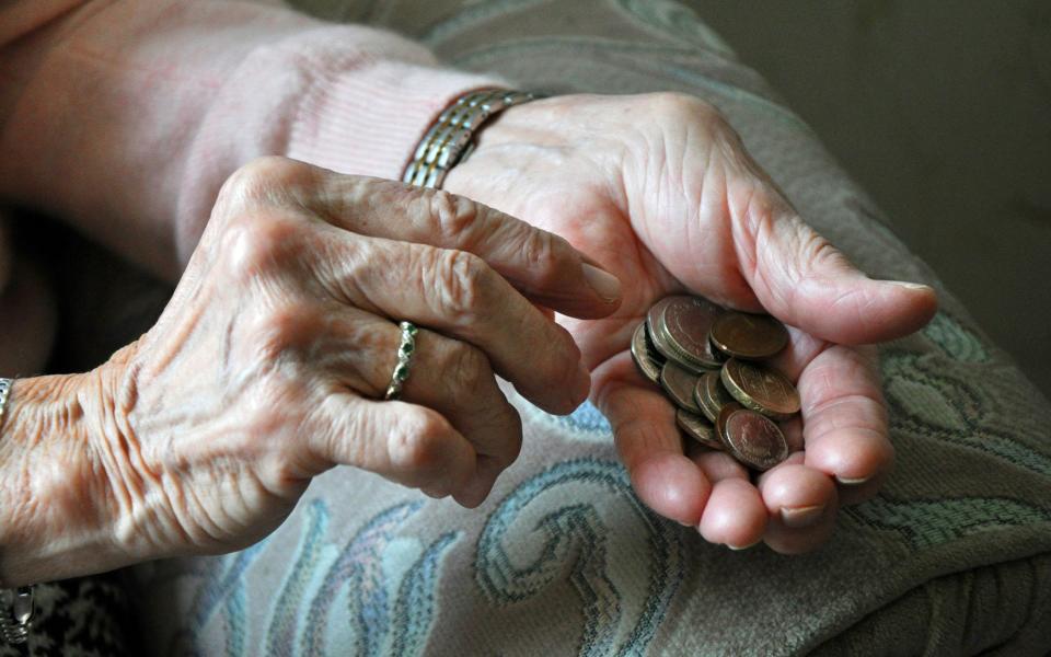 File photo dated 04/03/16 of an elderly woman counting loose change.  - PA/Kirsty O'Connor