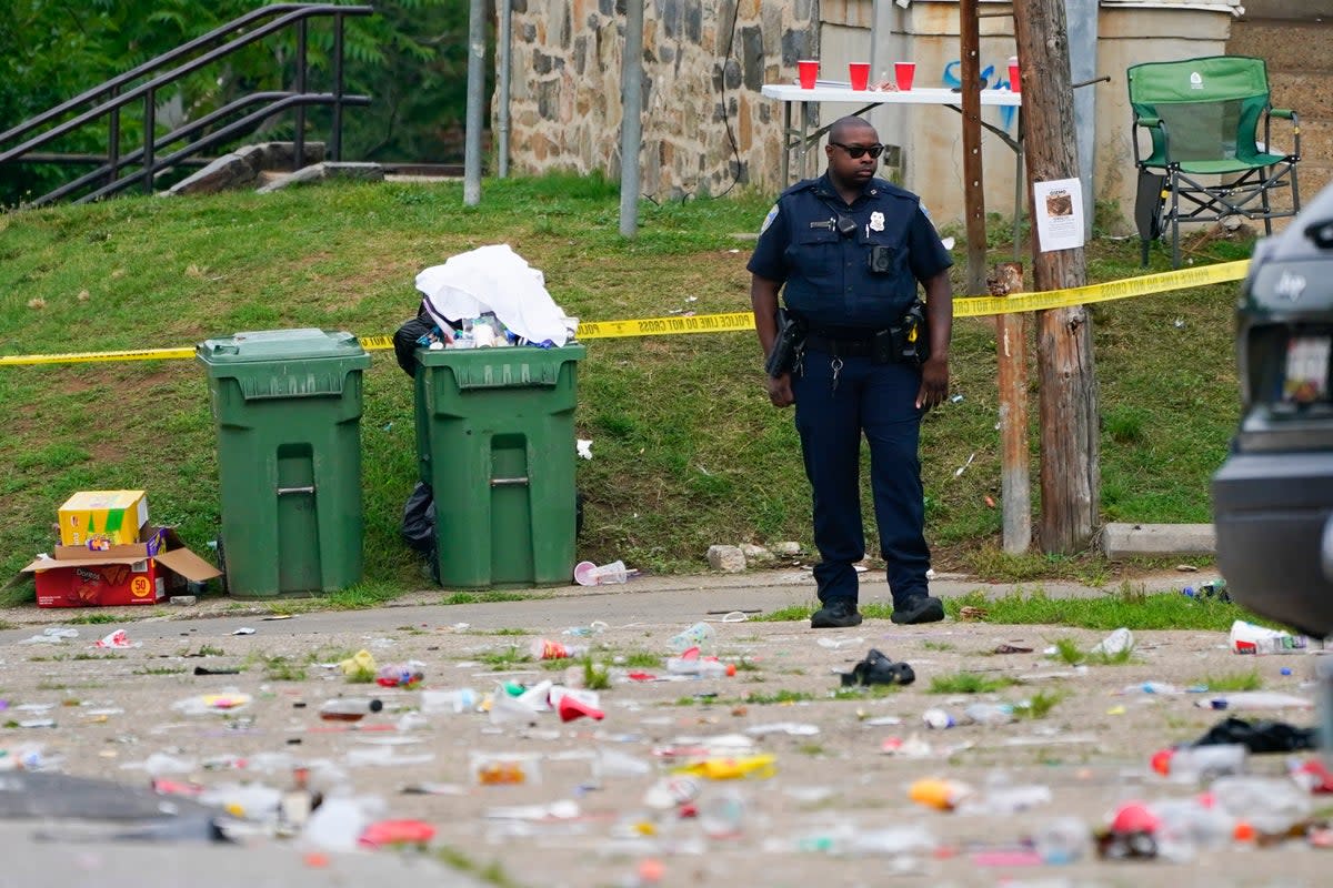 A police officer stands in the area of the mass shooting in Baltimore (Copyright 2023 The Associated Press. All rights reserved)