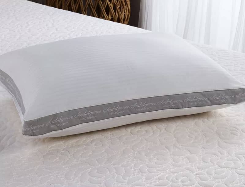 white pillow on mattress
