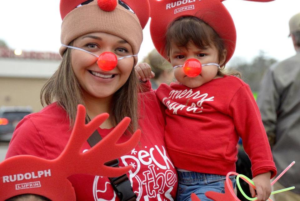 Rebecca Ramos, top left, and her children, from left, Julie, Christina and Victoria, are decked out with noses and antlers at the Rudolph the Red Nosed Pumping Unit lighting ceremony in downtown Lufkin, TX, Friday, December 1, 2023.