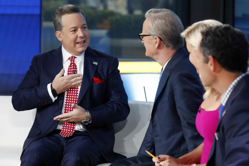 FILE - Fox News Chief National Correspondent Ed Henry, left, appears with co-hosts Steve Doocy, second left, Ainsley Earhardt, and Brian Kilmeade on the "Fox & friends" television program, in New York on Sept. 6, 2019. Fox News has fired news anchor Henry after it received a complaint about workplace sexual misconduct by him. Fox said the current complaint was based on an incident that happened ‘years ago.’ (AP Photo/Richard Drew, File)