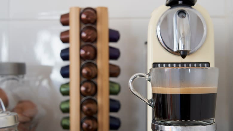 nespresso brewing coffee on counter