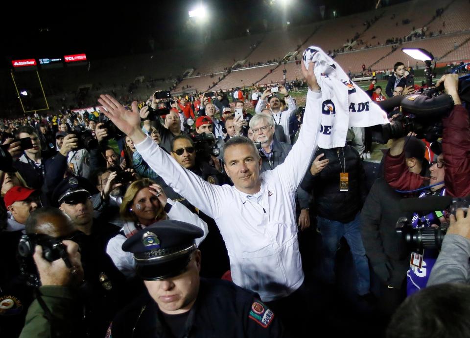 Ohio State coach Urban Meyer salutes fans after his final game as Ohio State's football coach, a 28-23 win over Washington in the Rose Bowl on Jan. 1, 2019.