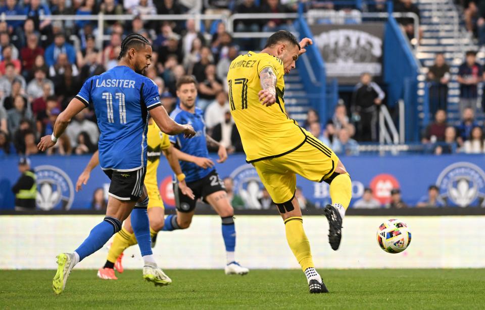 May 15, 2024; Montreal, Quebec, CAN; Columbus Crew forward Christian Ramirez (17) shoots against CF Montreal forward Ariel Lassiter (11) during the first half at Stade Saputo. Mandatory Credit: David Kirouac-USA TODAY Sports