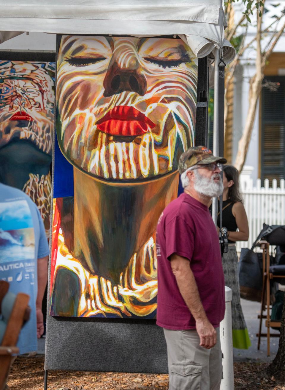 Art lovers check out the art for sale during the Great Gulfcoast Arts Festival in 2022. The festival returns to Seville Square Nov. 3 through Nov. 5, 2023.