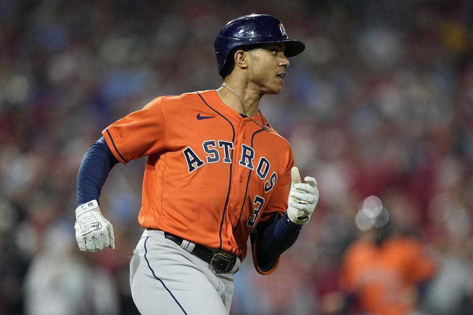 Houston Astros' Jeremy Pena watches his RBI single during the first inning in Game 5 of baseball's World Series between the Houston Astros and the Philadelphia Phillies on Thursday, Nov. 3, 2022, in Philadelphia. (AP Photo/David J. Phillip)
