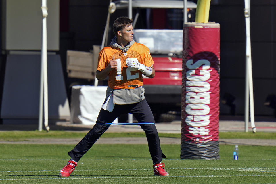 Tampa Bay Buccaneers quarterback Tom Brady (12) runs with an elastic band around his legs during an NFL football workout Thursday, Jan. 28, 2021, in Tampa, Fla. The Buccaneers play the Kansas City Chiefs in Super Bowl LV on Feb. 7. (AP Photo/Chris O'Meara)
