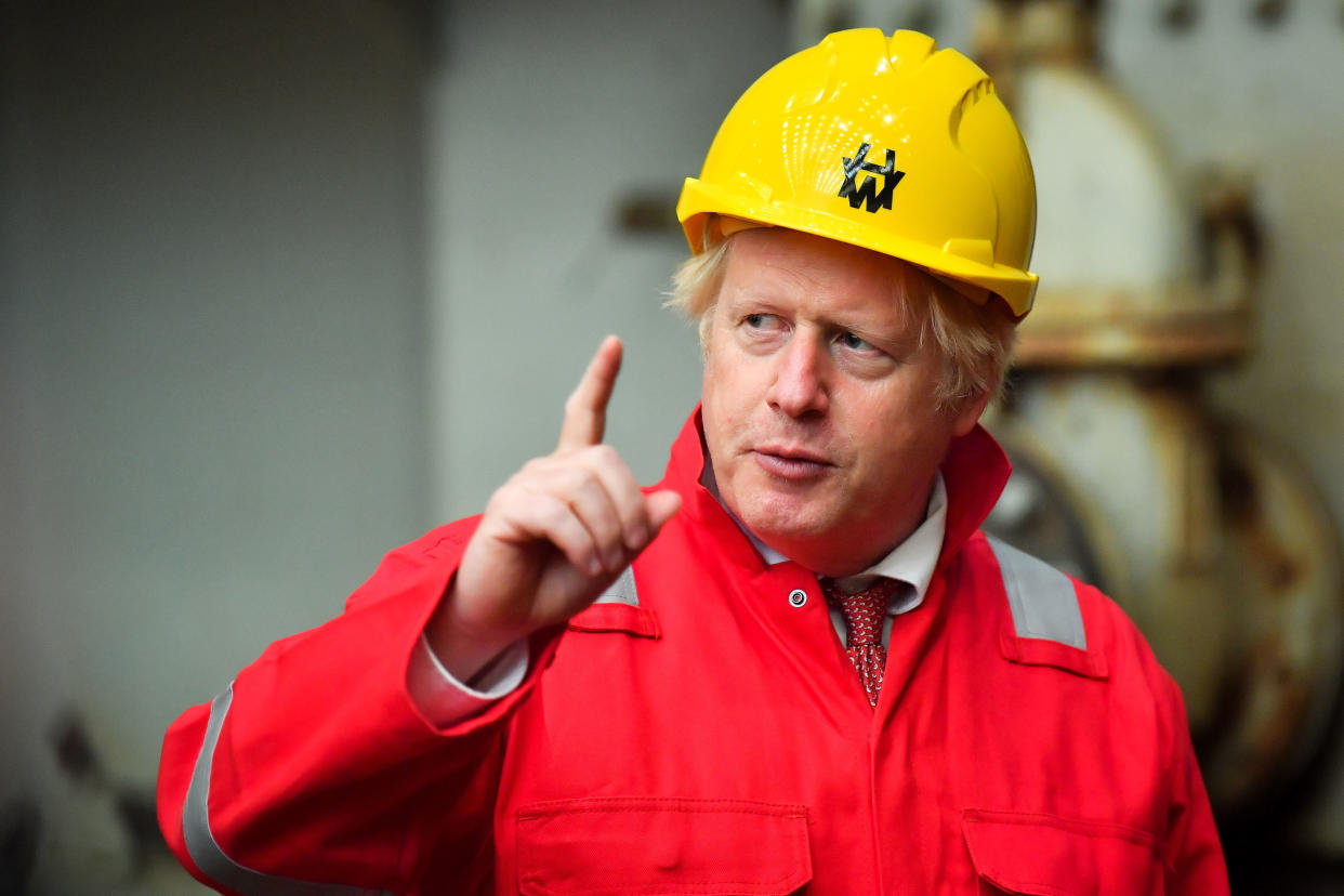 Britain's Prime Minister Boris Johnson gestures during his visit to Appledore Shipyard in south west England on August 25, 2020, as the historic shipyard announced it's re-opening having being bought by InfraStrata in a £7 million deal. (Photo by Ben Birchall / POOL / AFP) (Photo by BEN BIRCHALL/POOL/AFP via Getty Images)