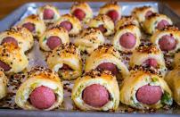 <p>You can never go wrong with pigs in a blanket. They're one of those <a href="https://www.thedailymeal.com/cook/deviled-eggs-retro-appetizers-recipes?referrer=yahoo&category=beauty_food&include_utm=1&utm_medium=referral&utm_source=yahoo&utm_campaign=feed" rel="nofollow noopener" target="_blank" data-ylk="slk:retro appetizers that are often overlooked;elm:context_link;itc:0;sec:content-canvas" class="link ">retro appetizers that are often overlooked</a> but remain a real crowd pleaser. Let your kids brush on the egg wash, roll up the dogs and top the pastries with everything bagel seasoning.</p> <p><a href="https://www.thedailymeal.com/recipes/everything-bagel-pigs-blanket-recipe?referrer=yahoo&category=beauty_food&include_utm=1&utm_medium=referral&utm_source=yahoo&utm_campaign=feed" rel="nofollow noopener" target="_blank" data-ylk="slk:For the Everything Bagel Pigs in a Blanket recipe, click here;elm:context_link;itc:0;sec:content-canvas" class="link ">For the Everything Bagel Pigs in a Blanket recipe, click here</a>.</p>