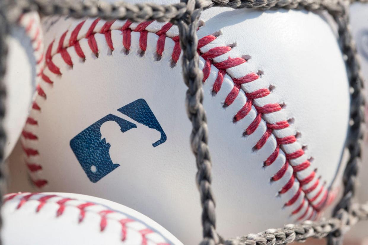 A baseball with MLB logo is seen at Citizens Bank Park before a game between the Washington Nationals and Philadelphia Phillies on June 28, 2018 in Philadelphia, Pa. Major league owners are still working out what the season will look like.