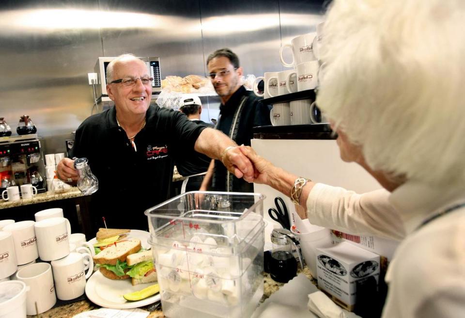 Pembroke Pines Mayor Frank Ortis greets a customer on opening day at Mayor’s Cafe in April 2012.