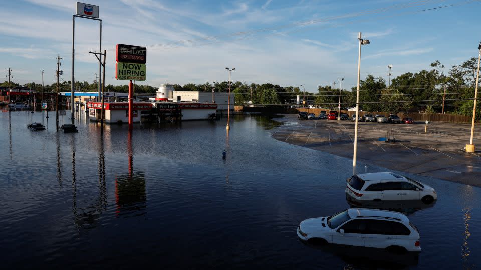 Cars and buildings are partially submerged in floodwaters in the aftermath of Hurricane Beryl in Houston on July 8, 2024. - Daniel Becerril/Reuters