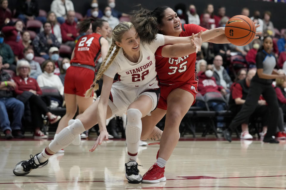 Stanford forward Cameron Brink, left, and Utah forward Alissa Pili compete for possession of the ball during the first half of an NCAA college basketball game in Stanford, Calif., Friday, Jan. 20, 2023. (AP Photo/Godofredo A. Vásquez)