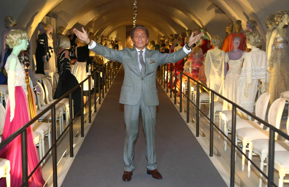 Italian designer Valentino poses for photographers during the 'Valentino: Master of Couture' Photocall at Somerset House in central London, Wednesday Nov. 28, 2012. Celebrating a 50-year career, the exhibition showcases over 130 hand-crafted designs worn by Grace Kelly, Sophia Loren and Gwyneth Paltrow. (Photo by Joel Ryan/Invision/AP)
