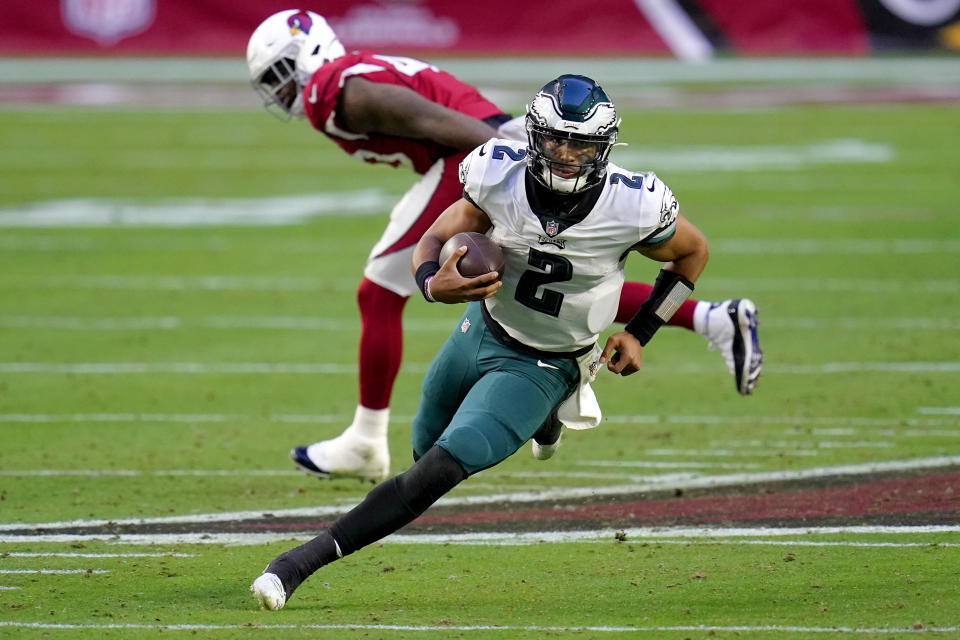 Philadelphia Eagles quarterback Jalen Hurts (2) scrambles against the Arizona Cardinals during the second half of an NFL football game, Sunday, Dec. 20, 2020, in Glendale, Ariz. (AP Photo/Ross D. Franklin)