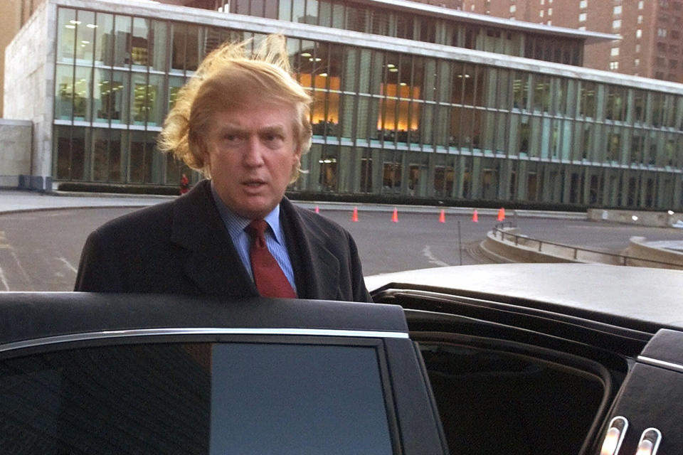 FILE - In this Jan. 9, 2001, file photo, Donald Trump, leaves the United Nations after meeting with Secretary-General Kofi Annan. When President Donald Trump visits the United Nations building in New York, he’s not just thinking about the global challenges the world body faces, he’s still got in mind the deal that got away. More than a decade later, Trump still relives the overtures he made to rebuild the 39-story tower in the early 2000s and posits that he could have done a better job of it. (AP Photo/Suzanne Plunkett, File)