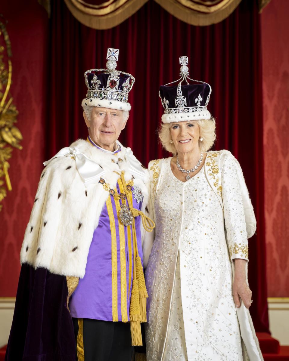 In this photo made available by Buckingham Palace on Monday, May 8, 2023, King Charles III and Queen Camilla are pictured in the Throne Room at Buckingham Palace, London. | Hugo Burnand/Royal Household 2023, Associated Press