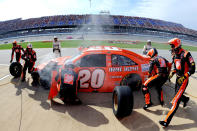 TALLADEGA, AL - OCTOBER 23: Joey Logano, driver of the #20 The Home Depot Toyota, makes a pit stop during the NASCAR Sprint Cup Series Good Sam Club 500 at Talladega Superspeedway on October 23, 2011 in Talladega, Alabama. (Photo by Jason Smith/Getty Images)