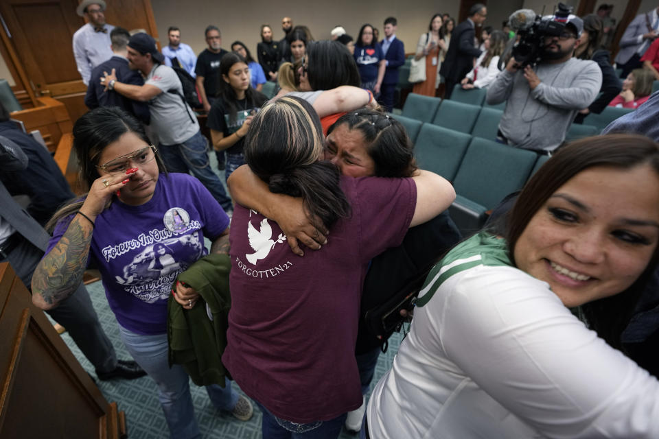 Family members of the victims of the Uvalde shootings react after a Texas House committee voted to take up a bill to limit the age for purchasing AR-15 style weapons in the full House in Austin, Texas, Monday, May 8, 2023. (AP Photo/Eric Gay)