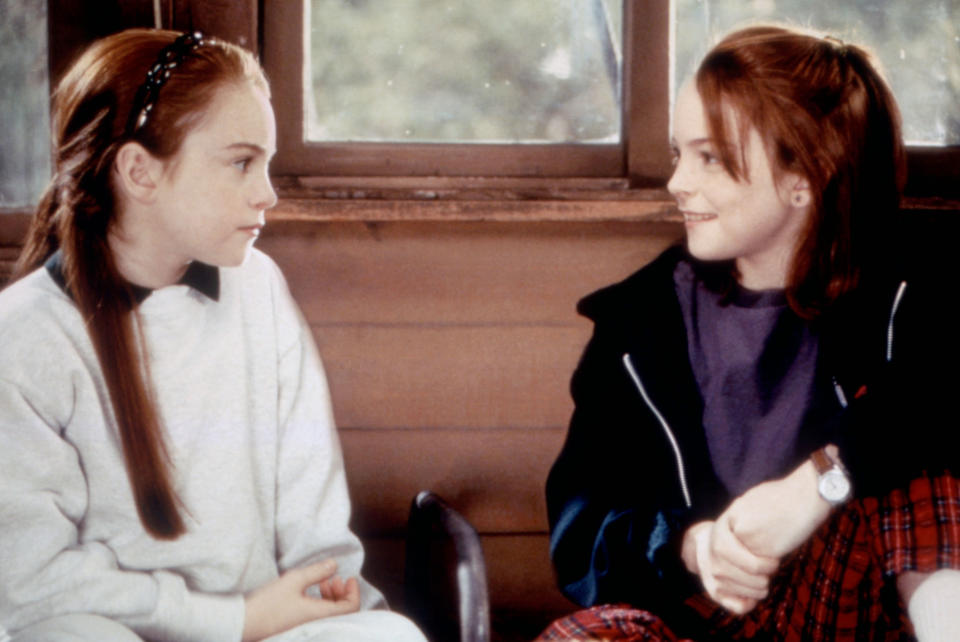 Lindsay Lohan, as identical twins Annie and Hallie, face each other and smile in a scene from "The Parent Trap" movie