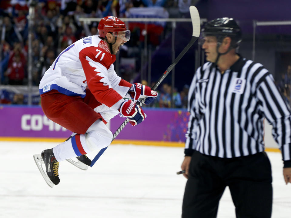 Russia forward Ilya Kovalchuk reacts after scoring a goal against Finland during the first period of a men's quarterfinal ice hockey game at the 2014 Winter Olympics, Wednesday, Feb. 19, 2014, in Sochi, Russia. (AP Photo/Julio Cortez)