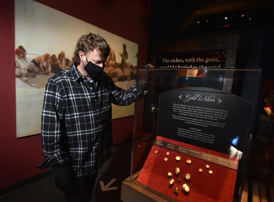 WEST YARMOUTH Chris Macort talks about some of the gold recovered from the wreck site on display at the Whydah Museum in West Yarmouth.