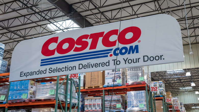 Costco sign above shelves