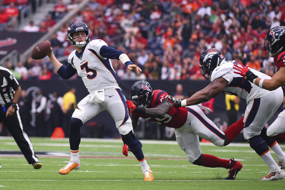 Denver Broncos quarterback Drew Lock (3) throws as he is pressured by Houston Texans outside linebacker Whitney Mercilus (59) during the first half of an NFL football game Sunday, Dec. 8, 2019, in Houston. (AP Photo/Eric Christian Smith)