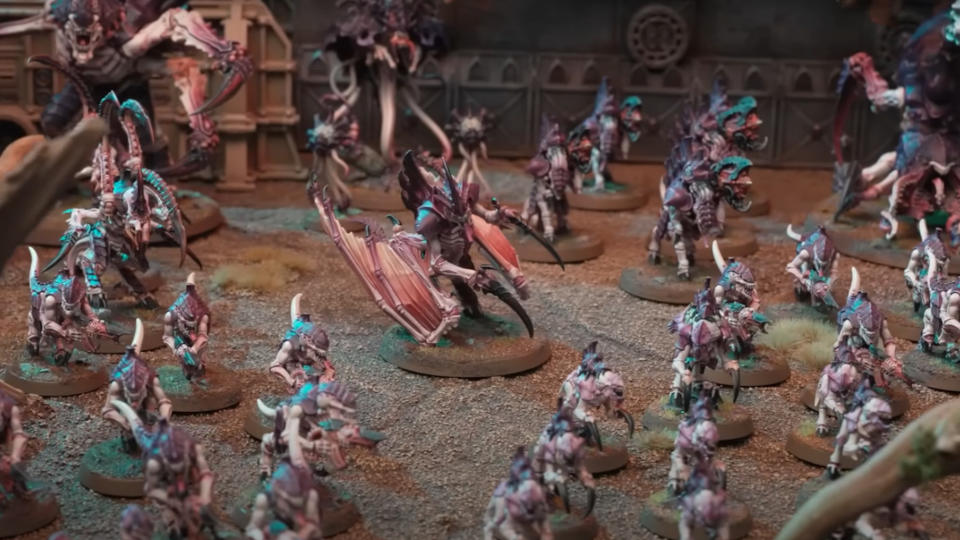 A Tyranid army from Warhammer 40,000 10th Edition swarms across the battlefield