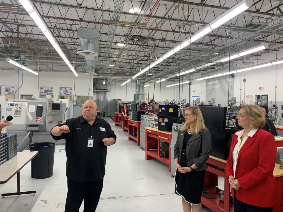 James Smith, a machining instructor at GateWay Community College in Phoenix, pictured here showing Phoenix Mayor Kate Gallego and MCCCCD governing board member Susan Bitter Smith the machining space.