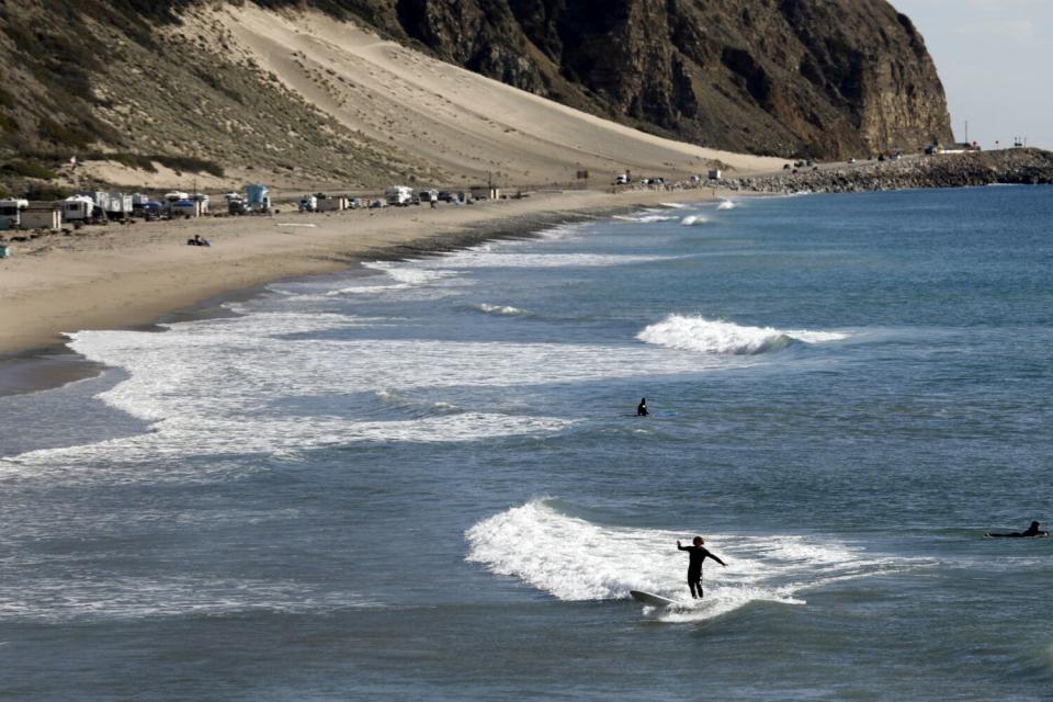 At Deer Creek Beach, north of Malibu on Pacific Coast Highway, people enjoy the warm weather on Nov. 22, 2021.