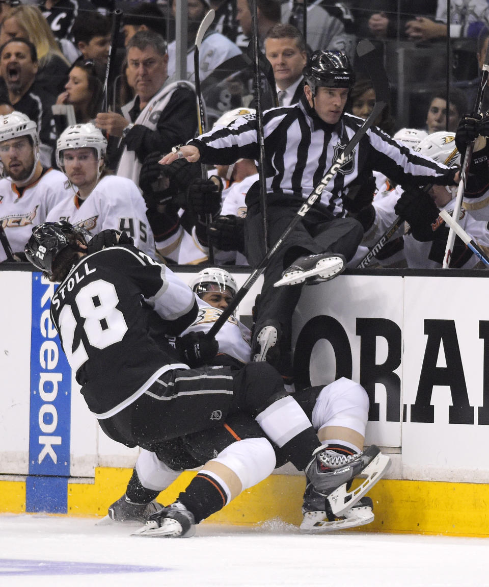 Los Angeles Kings center Jarret Stoll, left, and Anaheim Ducks right wing Devante Smith-Pelly collide during the first period in Game 4 of an NHL hockey second-round Stanley Cup playoff series, Saturday, May 10, 2014, in Los Angeles. (AP Photo/Mark J. Terrill)