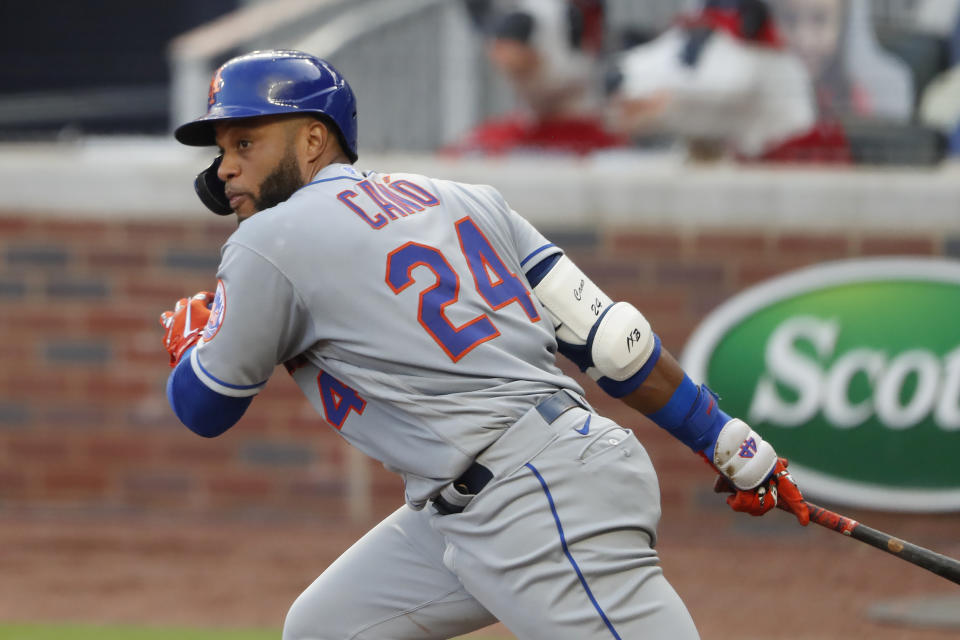 New York Mets' Robinson Cano drives in a run with a base hit in the third inning of a baseball game against the Atlanta Braves, Monday, Aug. 3, 2020, in Atlanta. (AP Photo/John Bazemore)