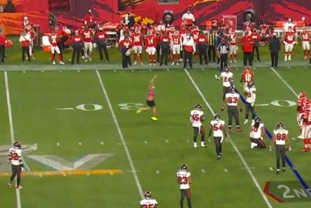 Streaker: Fan in pink one-piece runs on field during Super Bowl LV